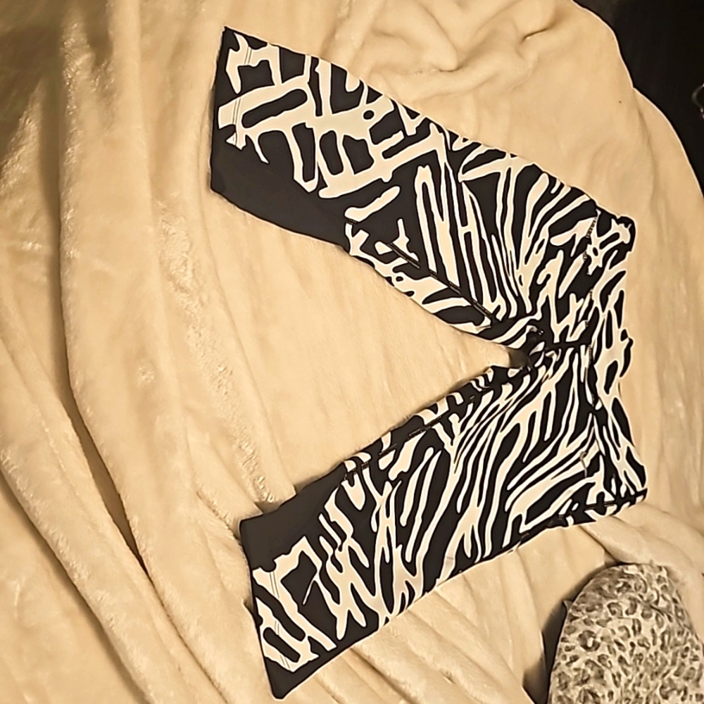 Zebra print Nike DRI -FIT  SMALL PERFECT  CONDITION NEVER WORN.